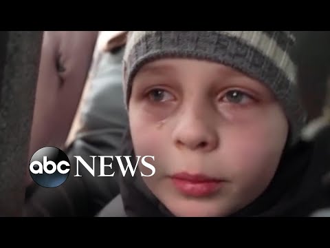 Heartbreaking moment boy says he left his father in Kyiv